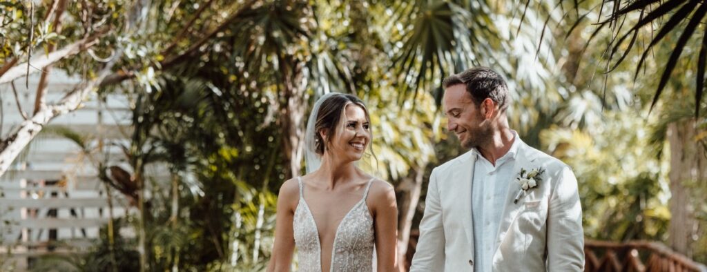 Bride and groom holding hands during their wedding shoot at the Andaz Hotel