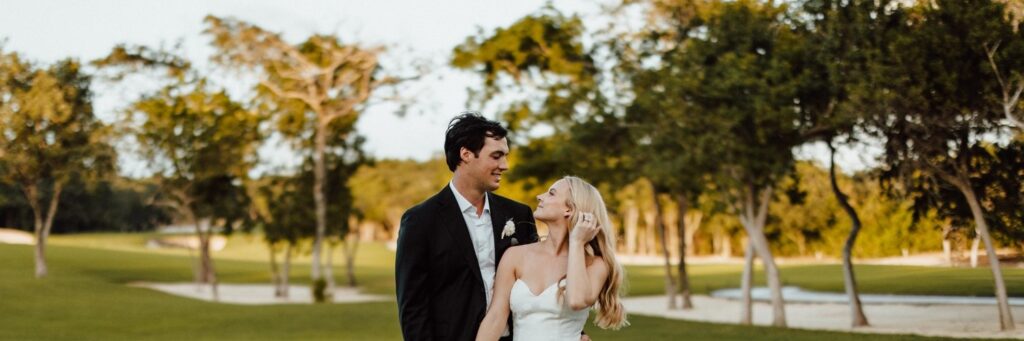 Bride and groom looking at each other endearingly during their wedding shoot arranged by Mango Weddings and Events